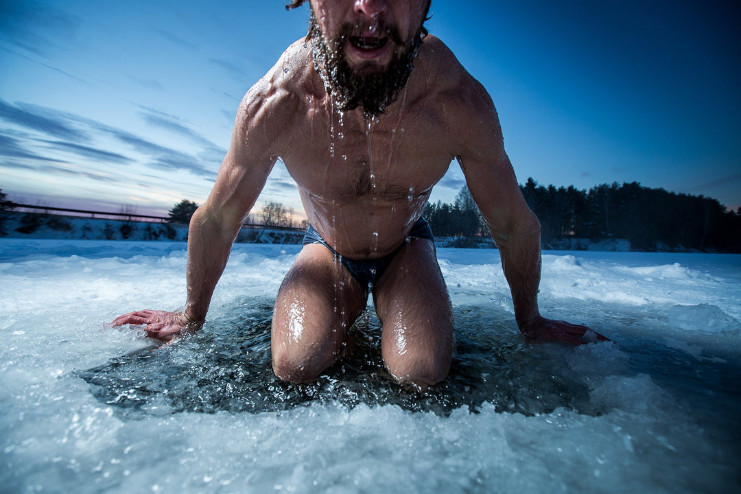 Man emerging from a cold plunge in a river
