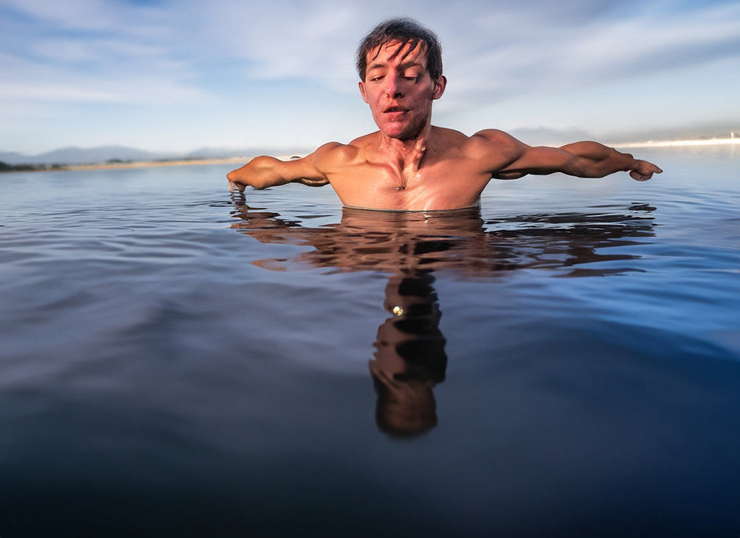 Man stretching in the water